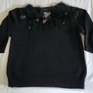 Elegant Black Sweater with Feather Detail